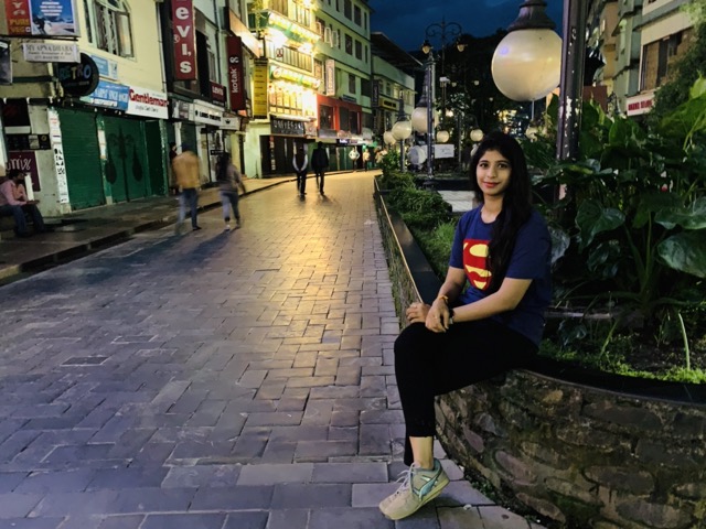 Sitting on MG Marg at night